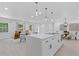 Open living space with kitchen island, dining area, and stylish furnishings, offering seamless flow and natural light at 3614 N Druid Hills N Rd, Decatur, GA 30033
