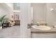 Bathroom featuring single sink vanity with a view of the carpeted living room at 385 Eagles Nest Cir, Carrollton, GA 30116