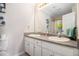Bathroom featuring double sink vanity and a large mirror with vanity lighting at 385 Eagles Nest Cir, Carrollton, GA 30116