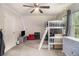 Cozy bedroom with bunkbed, ceiling fan, carpeted floor, LED accent lighting, and two windows at 385 Eagles Nest Cir, Carrollton, GA 30116