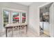 Kitchen dining nook with natural light from bay window and pantry with laundry unit at 385 Eagles Nest Cir, Carrollton, GA 30116