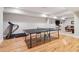 Finished basement featuring hardwood floors and a ping pong table at 4085 Hillcrest View Ct, Suwanee, GA 30024