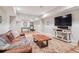 Finished basement with a game area, comfortable seating and an entertainment center at 4085 Hillcrest View Ct, Suwanee, GA 30024