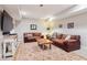 Cozy finished basement with a large area rug, leather sofas and a unique coffee table at 4085 Hillcrest View Ct, Suwanee, GA 30024