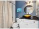 Stylish bathroom with modern vanity, a vessel sink, and a combined shower and tub at 4085 Hillcrest View Ct, Suwanee, GA 30024