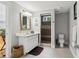 Bright bathroom with tile floors, a vanity, and a tiled shower at 4085 Hillcrest View Ct, Suwanee, GA 30024