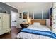 Bright bedroom featuring hardwood floors, stylish decor, and plenty of natural light at 4085 Hillcrest View Ct, Suwanee, GA 30024