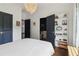 Well-lit bedroom featuring closet space and convenient access to the ensuite bathroom and hallway at 4085 Hillcrest View Ct, Suwanee, GA 30024