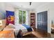 Cozy bedroom featuring a bed, natural light, and stylish decor at 4085 Hillcrest View Ct, Suwanee, GA 30024