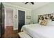 Cozy bedroom featuring a cowhide headboard, hardwood floors, and ensuite bathroom at 4085 Hillcrest View Ct, Suwanee, GA 30024