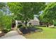 Beautiful brick home featuring manicured landscaping and a paved driveway leading to the welcoming front entrance at 4085 Hillcrest View Ct, Suwanee, GA 30024