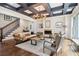 Elegant living room boasts a coffered ceiling, fireplace, and hardwood floors at 4085 Hillcrest View Ct, Suwanee, GA 30024