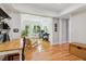 Bright living room with hardwood floors, white walls, natural light, and an open floor plan at 4085 Hillcrest View Ct, Suwanee, GA 30024