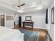 Spacious main bedroom featuring tray ceiling, hardwood floors and access to another room at 4085 Hillcrest View Ct, Suwanee, GA 30024