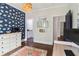 Bright office space featuring patterned wallpaper, wood floors, and modern decor at 4085 Hillcrest View Ct, Suwanee, GA 30024