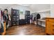 Spacious walk-in closet with hardwood floors, custom shelves and plenty of storage space at 4085 Hillcrest View Ct, Suwanee, GA 30024