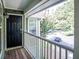 Inviting front door entrance with wood deck and green exterior, offering a warm welcome at 510 Berkeley Woods Dr, Duluth, GA 30096