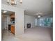 Open-concept view into the kitchen and living room, featuring a fireplace and large windows at 510 Berkeley Woods Dr, Duluth, GA 30096