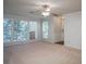 Expansive living room with abundant natural light, a ceiling fan, and neutral carpeting at 510 Berkeley Woods Dr, Duluth, GA 30096