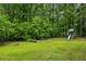 This home's spacious backyard provides plenty of room for to play and includes a swing set with slide at 5524 Wedgewood Sw Ct, Lilburn, GA 30047
