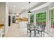 Bright breakfast nook with a glass table and views of the backyard at 5524 Wedgewood Sw Ct, Lilburn, GA 30047