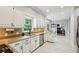 Bright kitchen featuring white cabinets, stainless steel appliances, and an eat-in breakfast area at 5524 Wedgewood Sw Ct, Lilburn, GA 30047