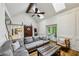 Bright living room with vaulted ceiling, skylights, hardwood floors, and access to the back patio at 5524 Wedgewood Sw Ct, Lilburn, GA 30047
