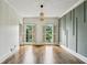 Inviting living room with hardwood floors and large windows, perfect for relaxation and entertaining at 5524 Wedgewood Sw Ct, Lilburn, GA 30047