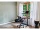Cozy room featuring a desk in front of a window with natural lighting at 5524 Wedgewood Sw Ct, Lilburn, GA 30047