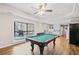 Basement recreation area with pool table, and access to the backyard at 735 Amberton Close, Suwanee, GA 30024