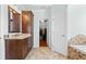 Bathroom with double vanity, walk-in closet and large soaking tub at 735 Amberton Close, Suwanee, GA 30024