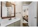 Well-lit bathroom featuring a vanity, walk-in shower, and separate toilet at 735 Amberton Close, Suwanee, GA 30024