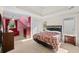 Bedroom with vaulted ceilings, ceiling fan, and sitting area at 735 Amberton Close, Suwanee, GA 30024