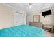 Bedroom with carpet floors, ceiling fan, and television at 735 Amberton Close, Suwanee, GA 30024