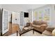 Inviting living room with a cozy seating area, fireplace, and access to the foyer at 735 Amberton Close, Suwanee, GA 30024