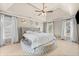 Spacious main bedroom with tray ceilings, carpeting, and ample natural light at 735 Amberton Close, Suwanee, GA 30024