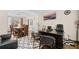 Comfortable home office adjacent to dining room, featuring an executive desk and decor at 735 Amberton Close, Suwanee, GA 30024