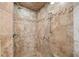 Tiled shower with tile accents, rainfall shower head and glass door at 735 Amberton Close, Suwanee, GA 30024