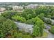 An aerial view of a multi-story apartment building surrounded by trees and city landscape at 113 Tuxworth Cir, Decatur, GA 30033