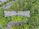A bird's eye view shows the rooftop of an apartment building, surrounded by trees at 113 Tuxworth Cir, Decatur, GA 30033