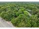 An aerial shot showing tree coverage around apartments and a nearby street at 113 Tuxworth Cir, Decatur, GA 30033