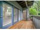 Balcony view with wood flooring, a window, and an open door that leads into the condo at 113 Tuxworth Cir, Decatur, GA 30033