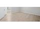 Bedroom featuring luxury vinyl plank flooring, large window, and neutral color palette at 113 Tuxworth Cir, Decatur, GA 30033