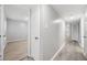 Hallway showcasing luxury vinyl plank flooring, and access to the bedrooms at 113 Tuxworth Cir, Decatur, GA 30033