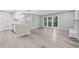 View of the open living area showcasing modern kitchen, patio doors and fireplace at 113 Tuxworth Cir, Decatur, GA 30033