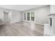 Bright living room featuring hardwood floors, fireplace and door to balcony with view at 113 Tuxworth Cir, Decatur, GA 30033