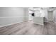 Open-concept living room featuring hardwood floors and seamless flow into the kitchen at 113 Tuxworth Cir, Decatur, GA 30033