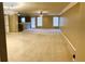 Spacious living room with carpet flooring, neutral walls, bright windows, and recessed lighting at 2385 Mayfair Dr, Cumming, GA 30040