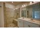 Modern bathroom with double sinks and a glass-enclosed shower at 2929 Rambler Dr, Loganville, GA 30052