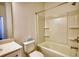 Bathroom featuring a shower-tub combination with built-in shelves and a toilet at 2929 Rambler Dr, Loganville, GA 30052